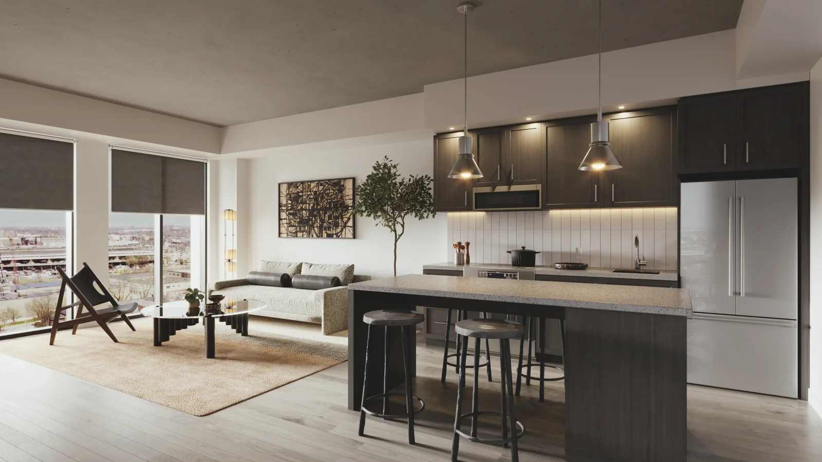 A one bedroom suite: an open kitchen with dark cabinetry and an island with stools, looking through to a living area and a window wall